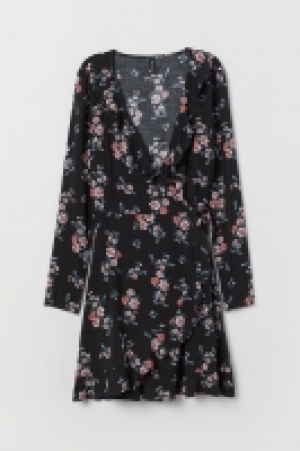  Vestido cruzado con volantes 8.99 €