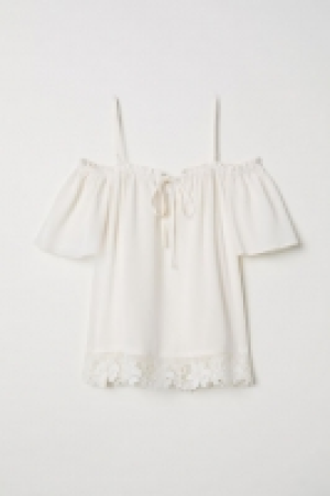  Blusa hombros cut-out 5.99 €