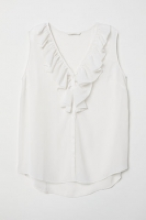  Blusa en V con volante 8.99 €