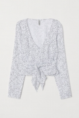  Blusa cruzada con escote en V 9.99 €