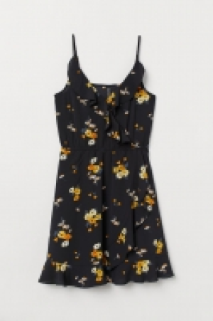  Vestido cruzado con volantes 13.99 €