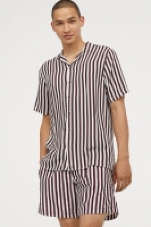  Camisa con cuello abierto 9.99 €