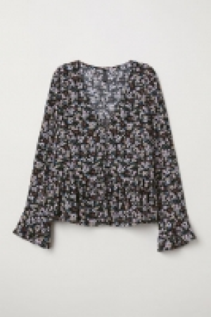  Blusa en V con botones 5.99 €