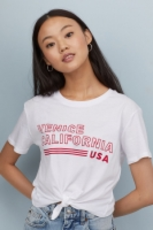  Camiseta corta con lazada 3.99 €