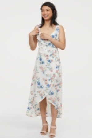  Vestido cruzado con volantes 23.99 €