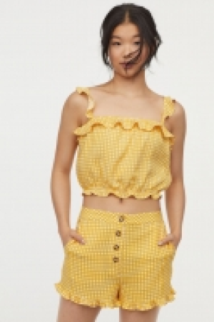  Top corto con volantes 13.99 €