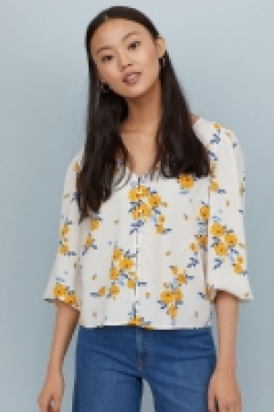 Blusa con escote de pico 8.99 €