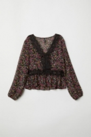 Blusa con escote de pico 12.99 €