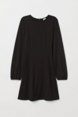  Vestido en punto de canalé 19.99 €