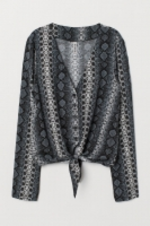  Blusa anudada con cuello en V 5.99 €