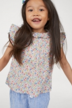  Blusa con volantes 6.99 €
