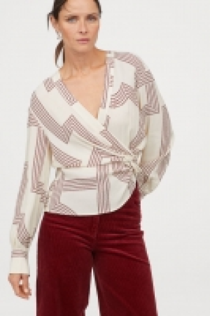  Blusa con nudo decorativo 12.99 €