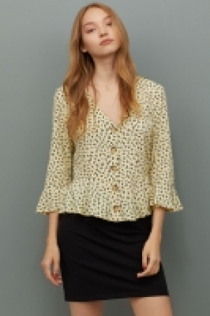  Blusa en V con botones 9.99 €