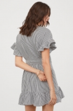 Vestido con volante 18.99 €