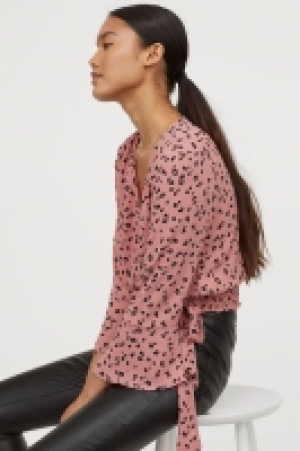  Blusa estampada cruzada 9.99 €