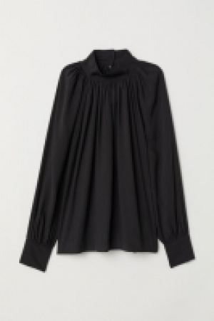  Blusa con mangas globo 23.99 €