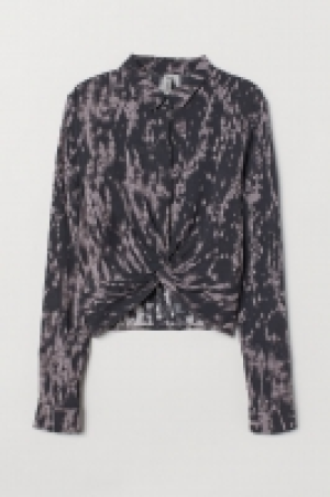  Blusa con nudo decorativo 5.99 €