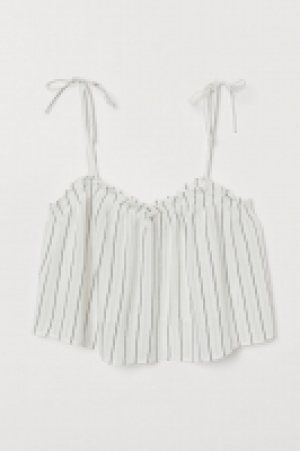  Top corto con volantes 12.99 €