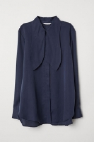  Blusa de lyocell con lazada 19.99 €