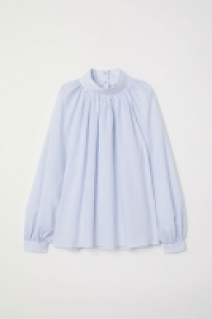  Blusa con mangas globo 27.99 €