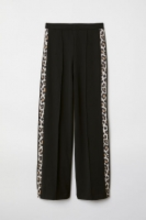  Pantalón con franjas laterales 23.99 €