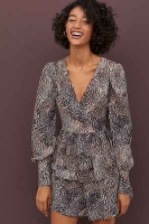  Vestido cruzado de volantes 34.99 €