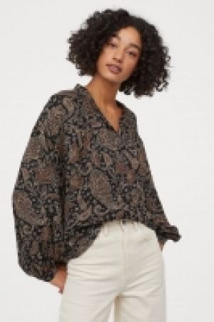  Blusa amplia de viscosa 13.99 €