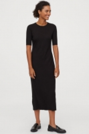  Vestido en punto de canalé 12.99 €