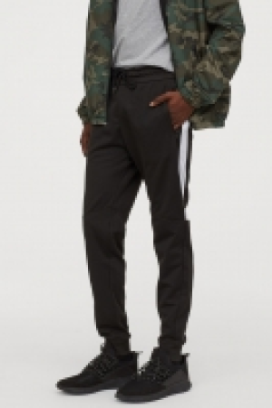  Pantalón sudadera con franjas 19.99 €