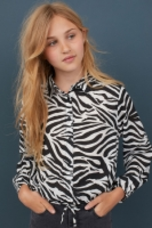  Blusa en tejido vaporoso 9.99 €