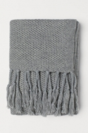  Manta de punto con flecos 29.99 €