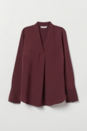  Blusa con escote de pico 12.99 €