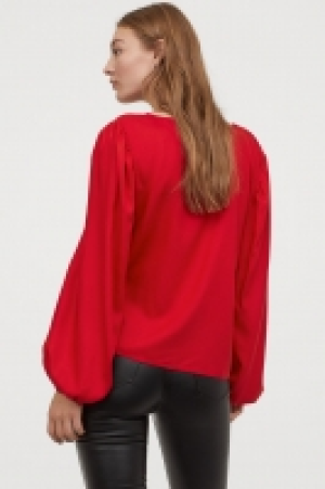  Blusa con mangas abullonadas 7.99 €