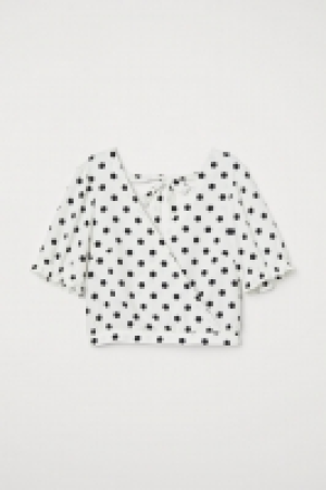 HM   Blusa cruzada con lazada