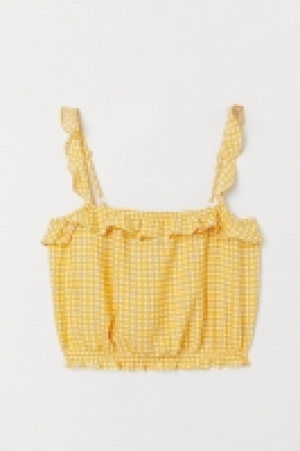  Top corto con volantes 13.99 €
