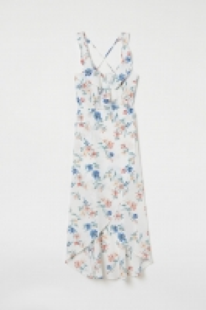  Vestido cruzado con volantes 23.99 €