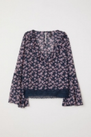  Blusa con escote de pico 20.99 €
