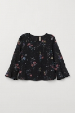  Blusa con mangas de volante 23.99 €