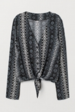  Blusa anudada con cuello en V 5.99 €