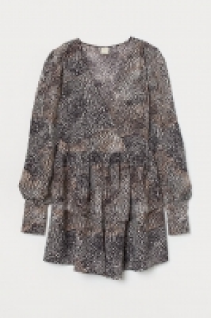  Vestido cruzado de volantes 34.99 €