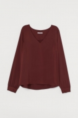 Blusa con escote de pico 15.99 €
