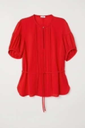 Blusa con mangas abullonadas 23.99 €
