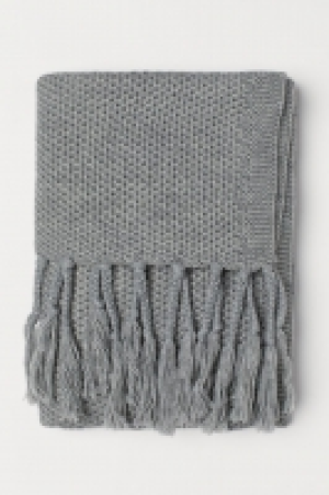 Manta de punto con flecos 29.99 €