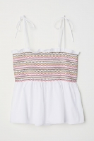 Top con fruncido y peplo 13.99 €