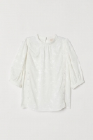 Blusa con mangas abullonadas 22.99 €