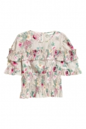 Blusa de algodón con volantes 11.99 €