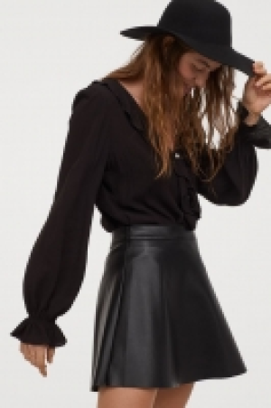Blusa de volantes escote en V 14.99 €