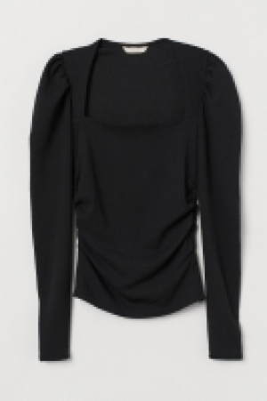 Top con mangas abullonadas 17.99 €