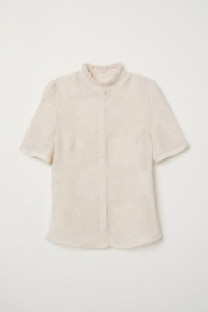 Blusa en tejido jacquard 27.99 €
