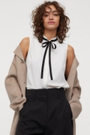 Blusa en tejido de crepé 12.99 €